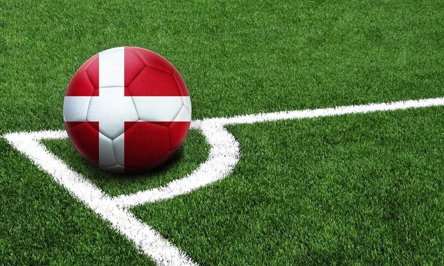 soccer ball on a green field, flag of Denmark